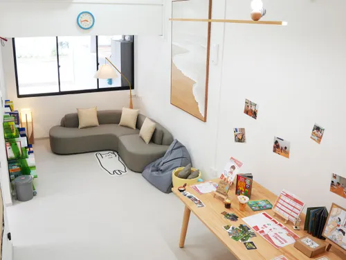 Bright learning lounge with soft seating and books